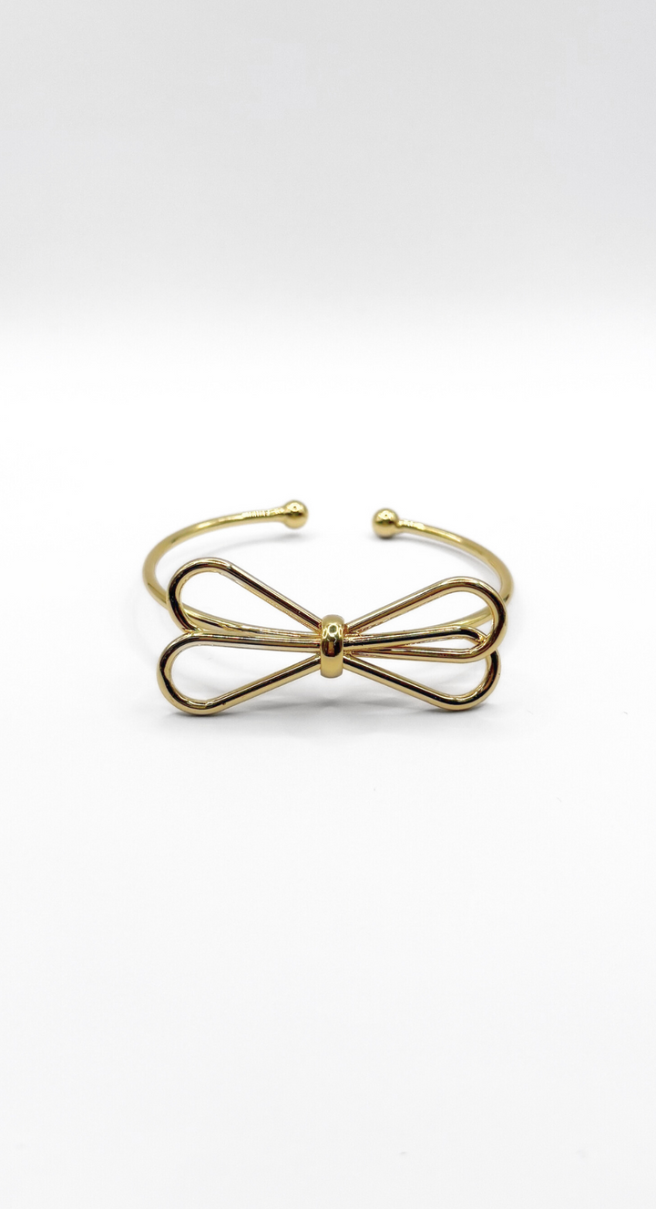 EMMA CLARA - BRAZALETE TIPO ESCLAVA DISEÑO LAZO EN FANTASÍA DORADA