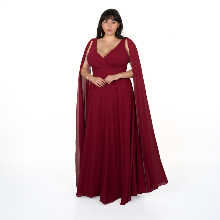 Vestido de fiesta largo color borgoña con escote cruzado, falda fluida y capa de gasa en hombros. Ideal para matrimonio, gala o evento formal.